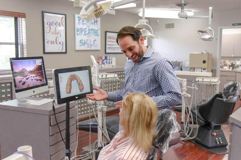 Dr. Rosenberg and adult orthodontic patient dental chair