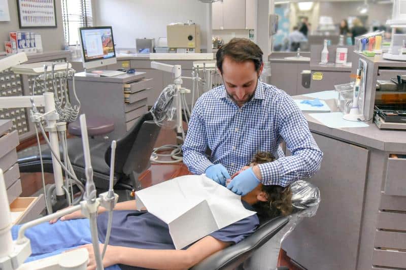 Dr. Rosenberg and patient in dental chair