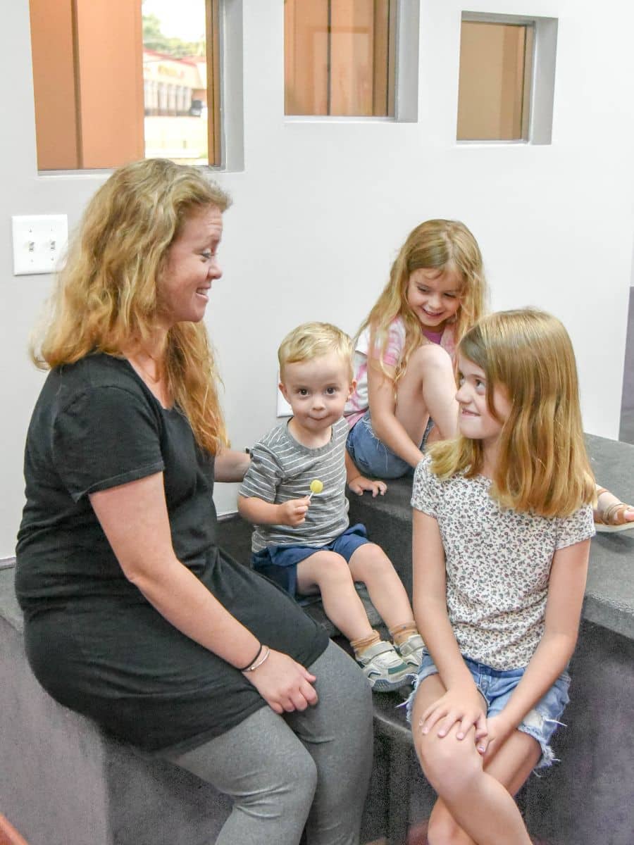 Pompton-plains-smile-experience-orthodontics Mother with children visiting smile experience orthodontics for orthodontic care for all ages
