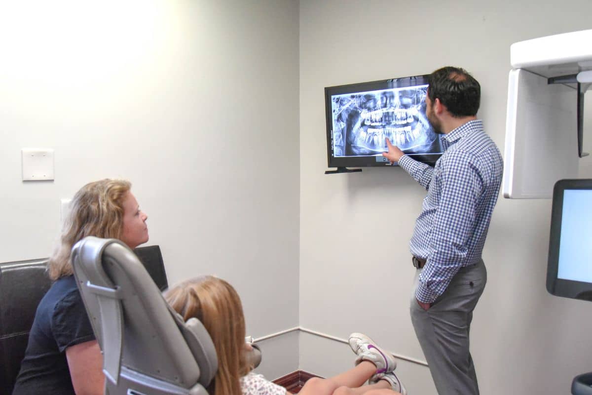 Dr. Rosenberg working with a patient at smile experience orthodontics in madison new jersey during an orthodontic appointment